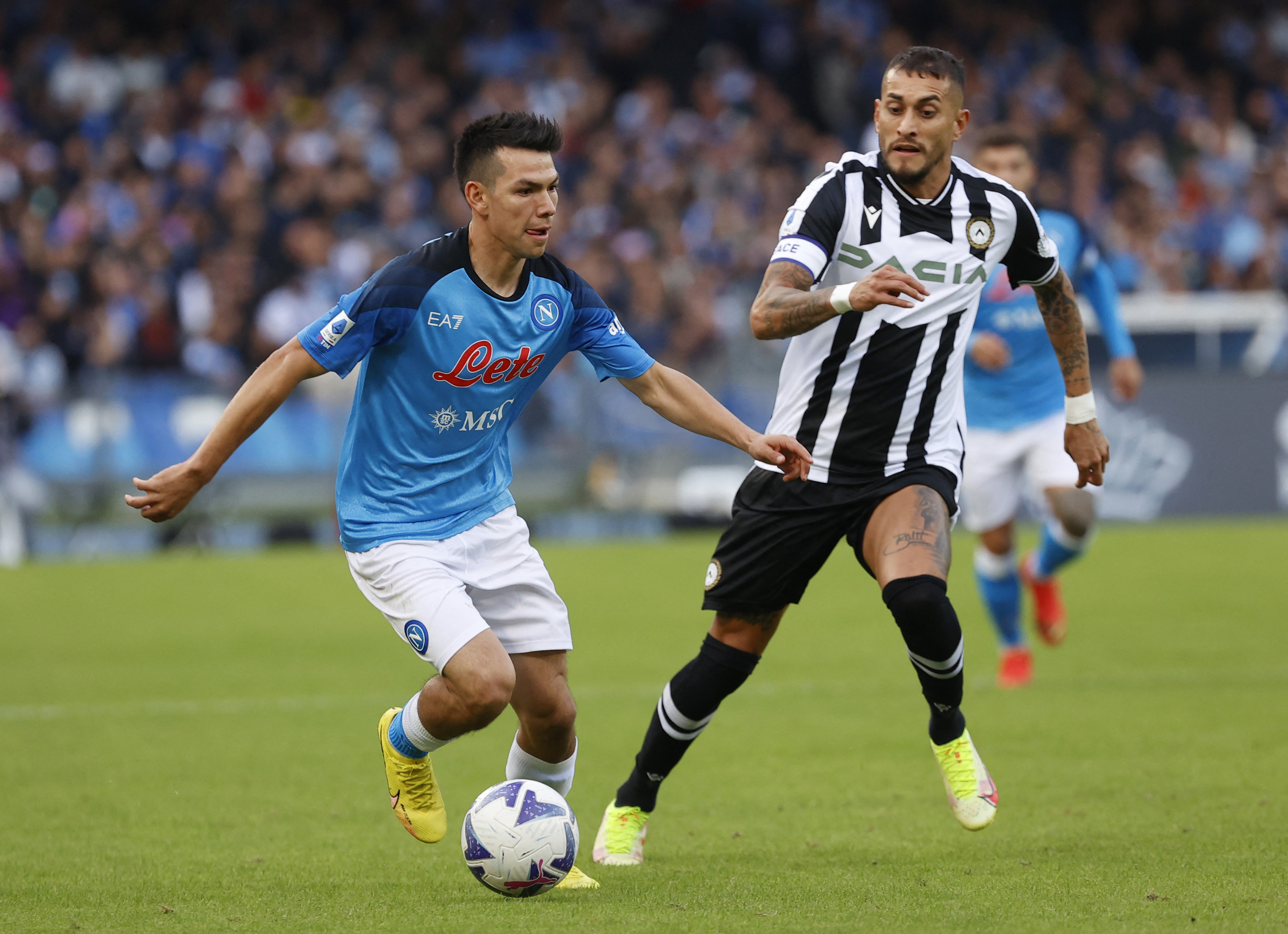 Soccer Football - Serie A - Napoli v Udinese - Stadio Diego Armando Maradona, Naples, Italy - November 12, 2022 Napoli's Hirving Lozano in action with Udinese's Roberto Pereyra REUTERS/Ciro De Luca