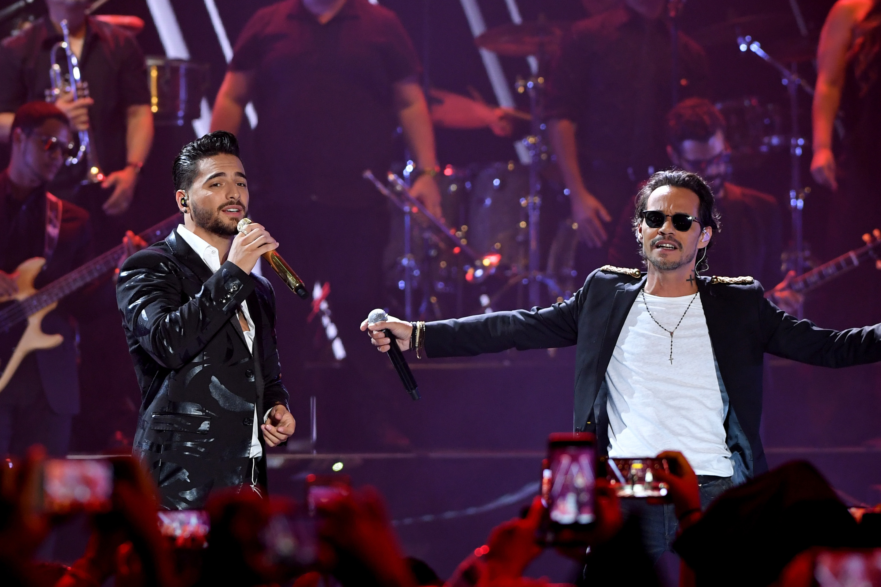 CORAL GABLES, FL - JULY 06: Maluma and Marc Anthony perform on stage during Univision's "Premios Juventud" 2017 Celebrates The Hottest Musical Artists And Young Latinos Change-Makers at Watsco Center on July 6, 2017 in Coral Gables, Florida.   Rodrigo Varela/Getty Images for Univision/AFP